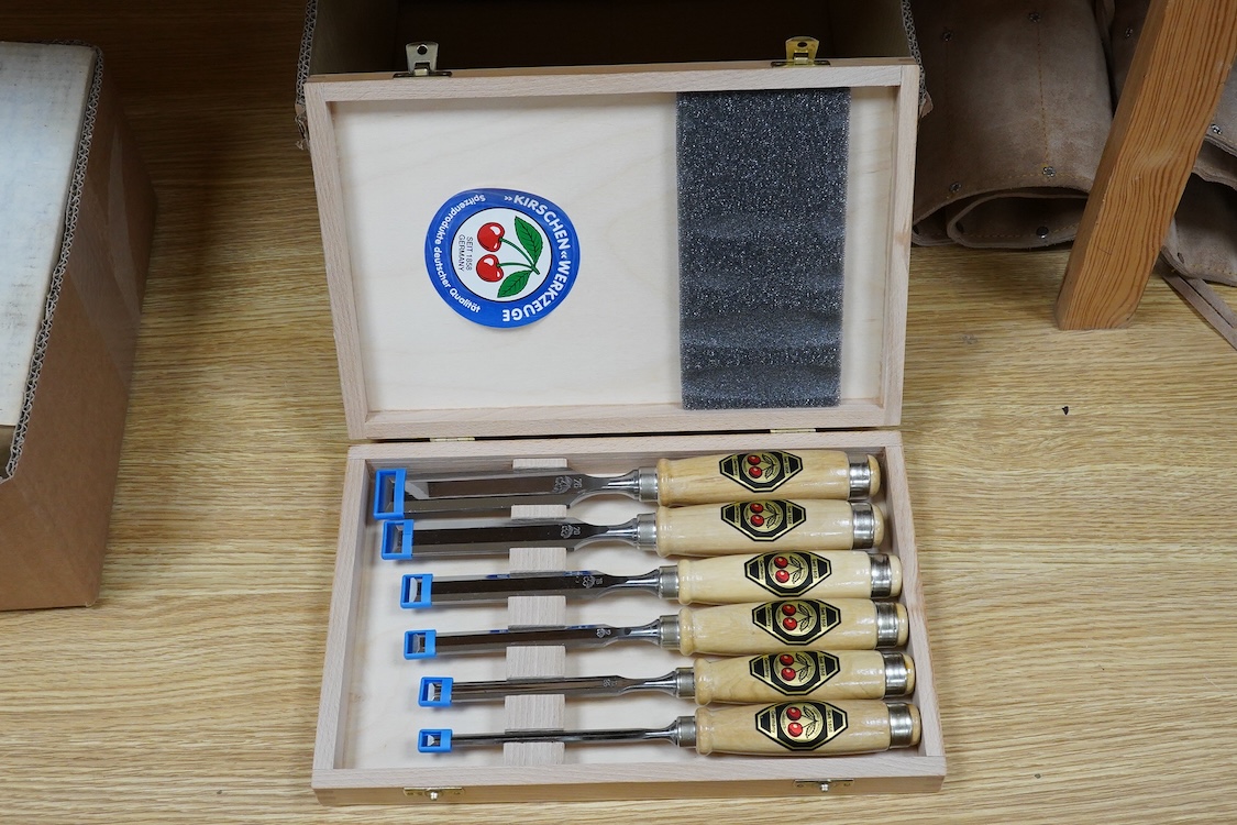Three sets of woodworking chisels, including a cased six piece set by Seit, Germany, a nine piece set by Herschel, Germany, in a leather roll and a Swiss made nine piece set also in a leather roll